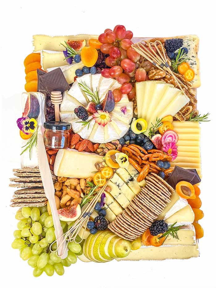 cheese platter with fruits and crackers